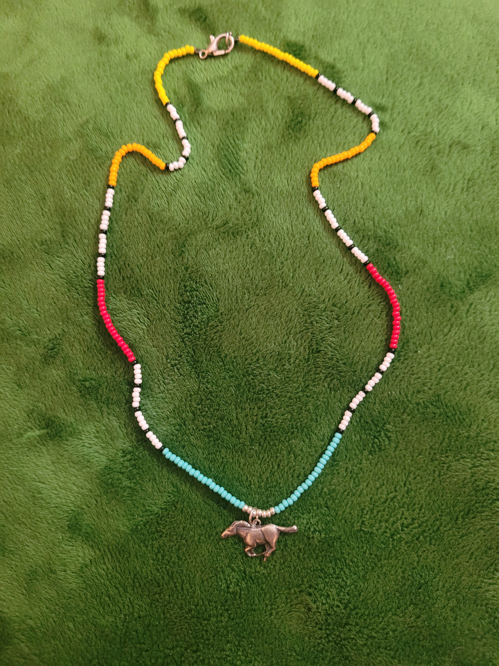 Canyon necklace with running horse charm