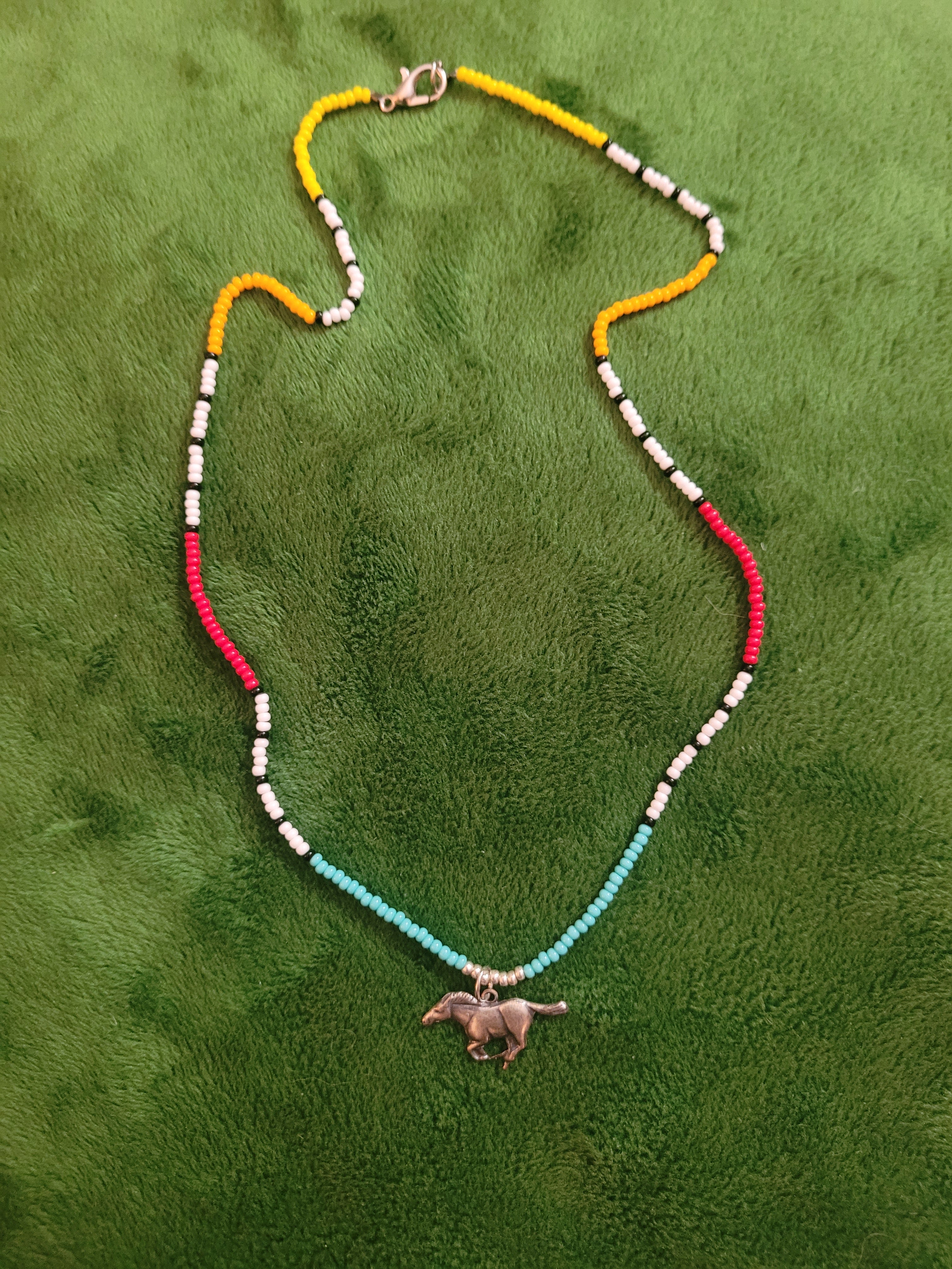 Canyon necklace with running horse charm