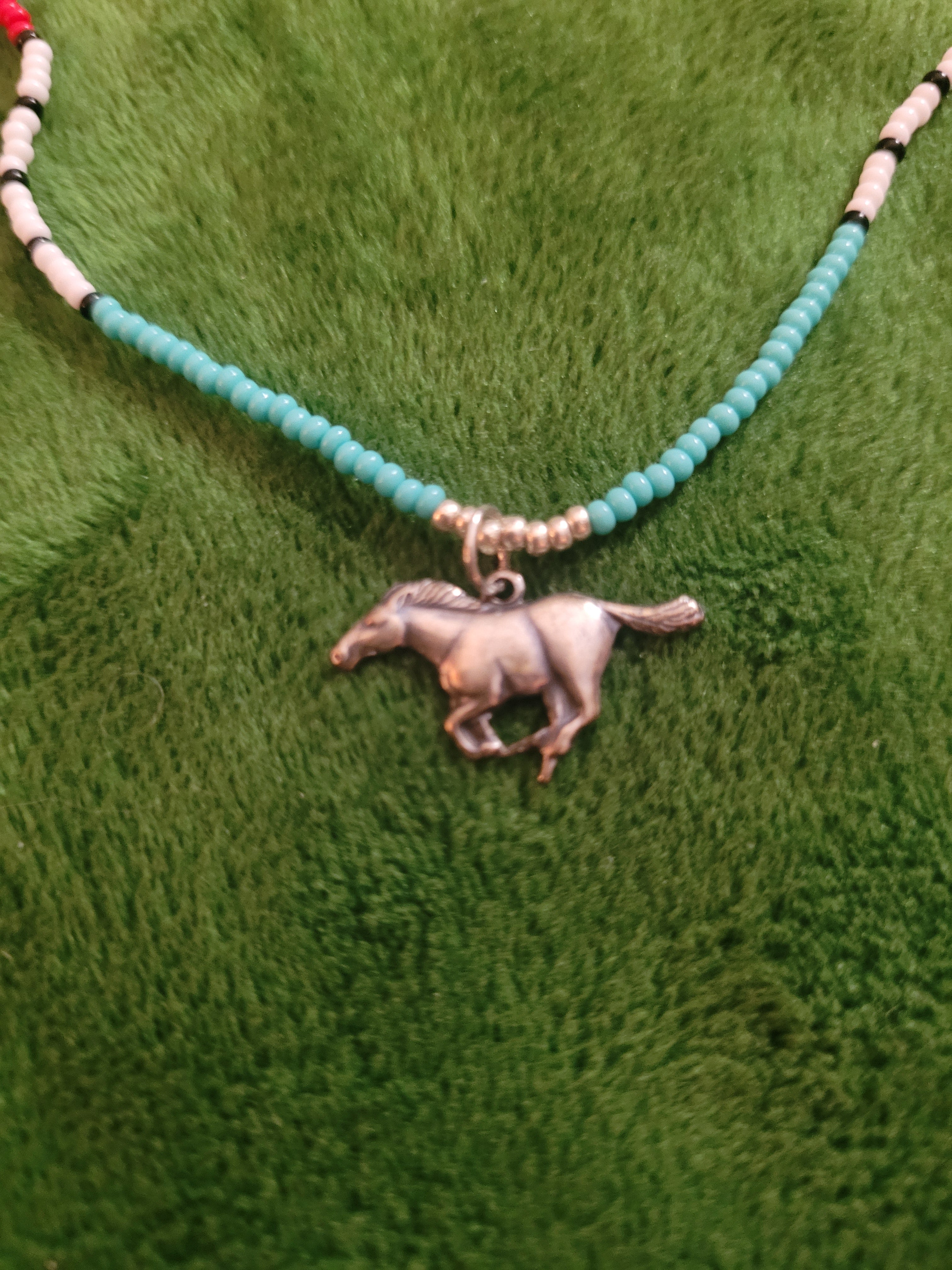 Canyon necklace with running horse charm
